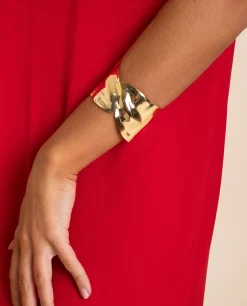 BRAZALETE CROSS LEAF · BAÑO ORO